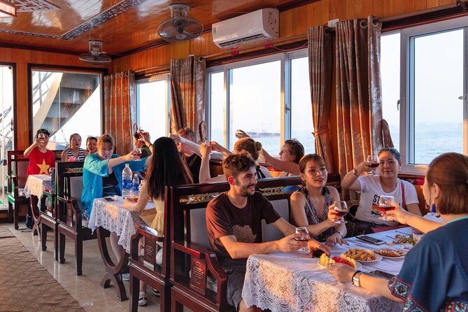 Halong Bay Day Tour With Titop Island, Cave, Kayak & Lunch - Kayaking or bamboo boat in the Hang Luon area