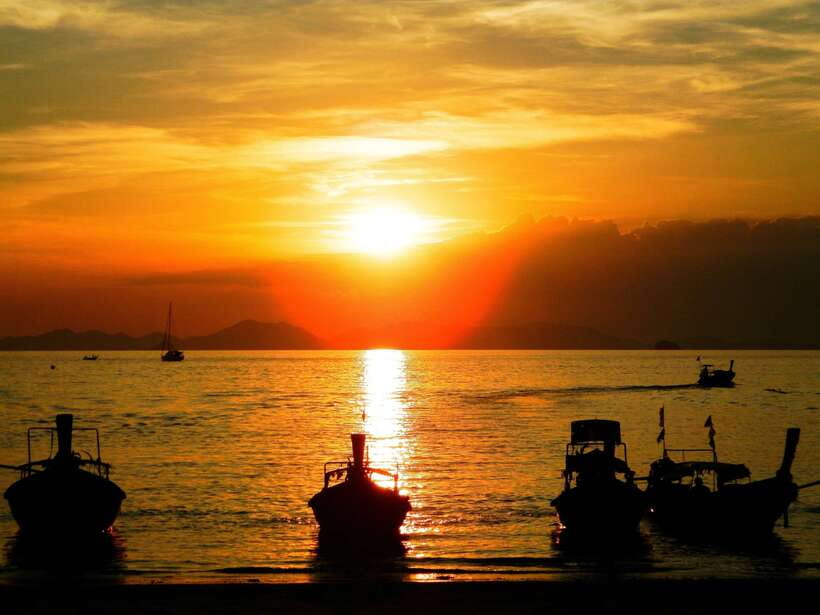 Krabi: 7 Islands Sunset Tour with Buffet Dinner & Snorkeling - Getting on the boat: pickup, Railay stop, and how the day starts
