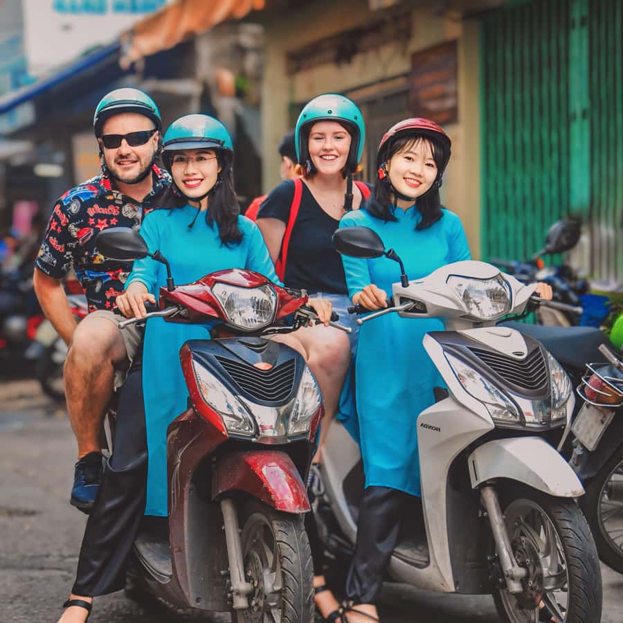 Saigon: Street Food Tasting & Sightseeing Tour by Motorbike - Scooter comfort and safety: helmets, trained drivers, and traffic reality