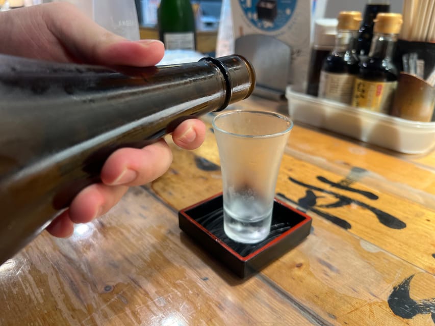 Tokyo: Shinjuku Food Tour (15 Dishes and 4 Eateries) - Where you meet in Shinjuku: α 107 Building and the blue AOKI clue